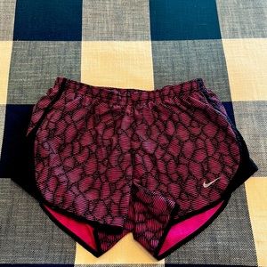 Nike dry fit shorts with liner and zip pocket on back. Ex.small, pink and black.